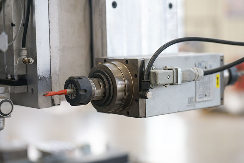 Front and rear machining spindle